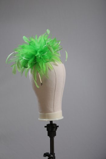 Ladies wedding or races apple lime green small feather and satin loop fascinator hat