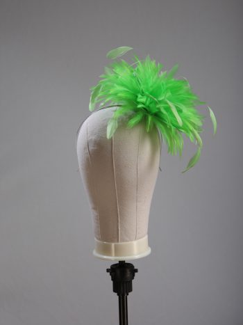 Ladies wedding or races apple lime green small feather and satin loop fascinator hat