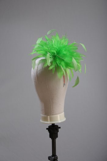 Ladies wedding or races apple lime green small feather and satin loop fascinator hat