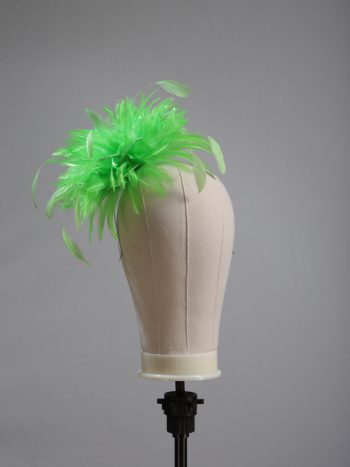 Ladies wedding or races apple lime green small feather and satin loop fascinator hat