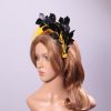 yellow halo crown with crin and black feather tree