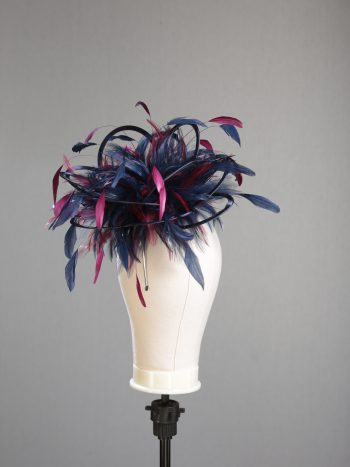 Ladies' formal Navy Blue and Burgundy Wine medium feather and satin loop fascinator hat. Suitable for a wedding or ladies' day at the races