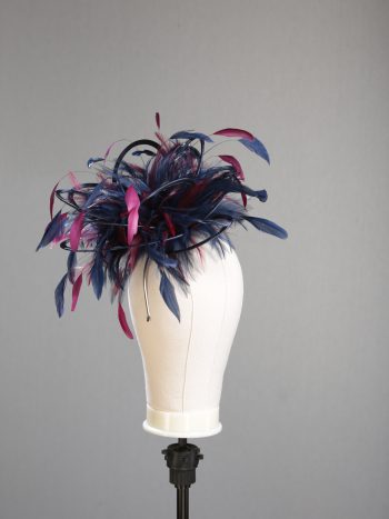 Ladies' formal Navy Blue and Burgundy Wine medium feather and satin loop fascinator hat. Suitable for a wedding or ladies' day at the races