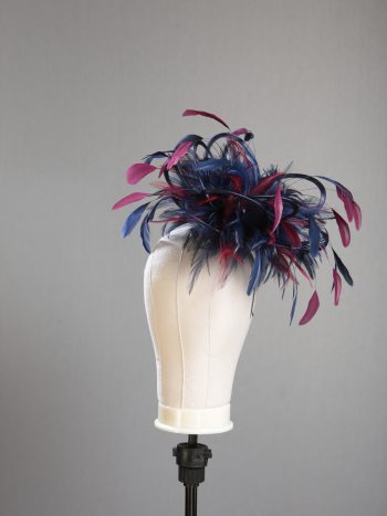 Ladies' formal Navy Blue and Burgundy Wine medium feather and satin loop fascinator hat. Suitable for a wedding or ladies' day at the races