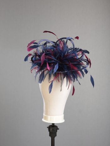 Ladies' formal Navy Blue and Burgundy Wine medium feather and satin loop fascinator hat. Suitable for a wedding or ladies' day at the races