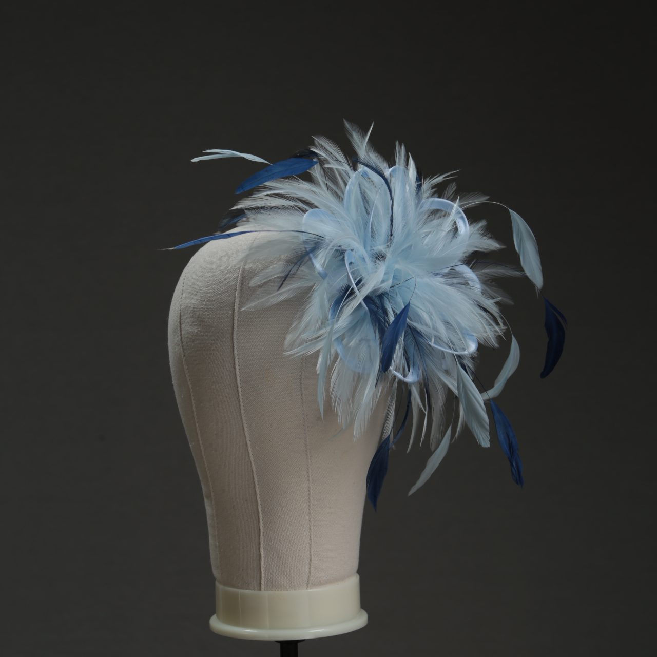 Ladies wedding or races baby blue and navy blue small feather and satin loop fascinator hat