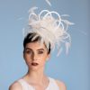 white satin loop and feather fascinator hat set on a headband