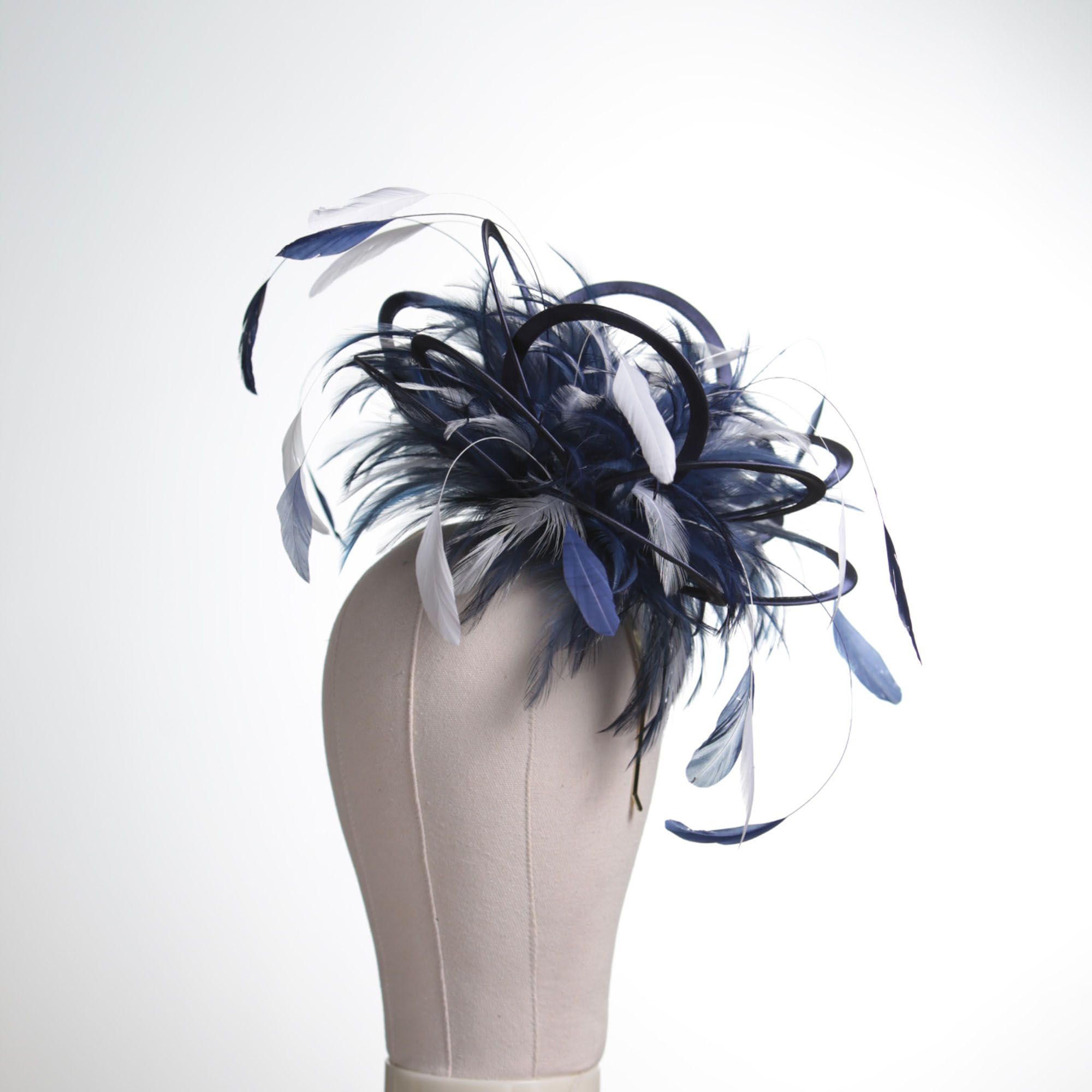Ladies formal Navy Blue and White medium feather and satin loop fascinator hat. Suitable for a wedding or ladies day at the races