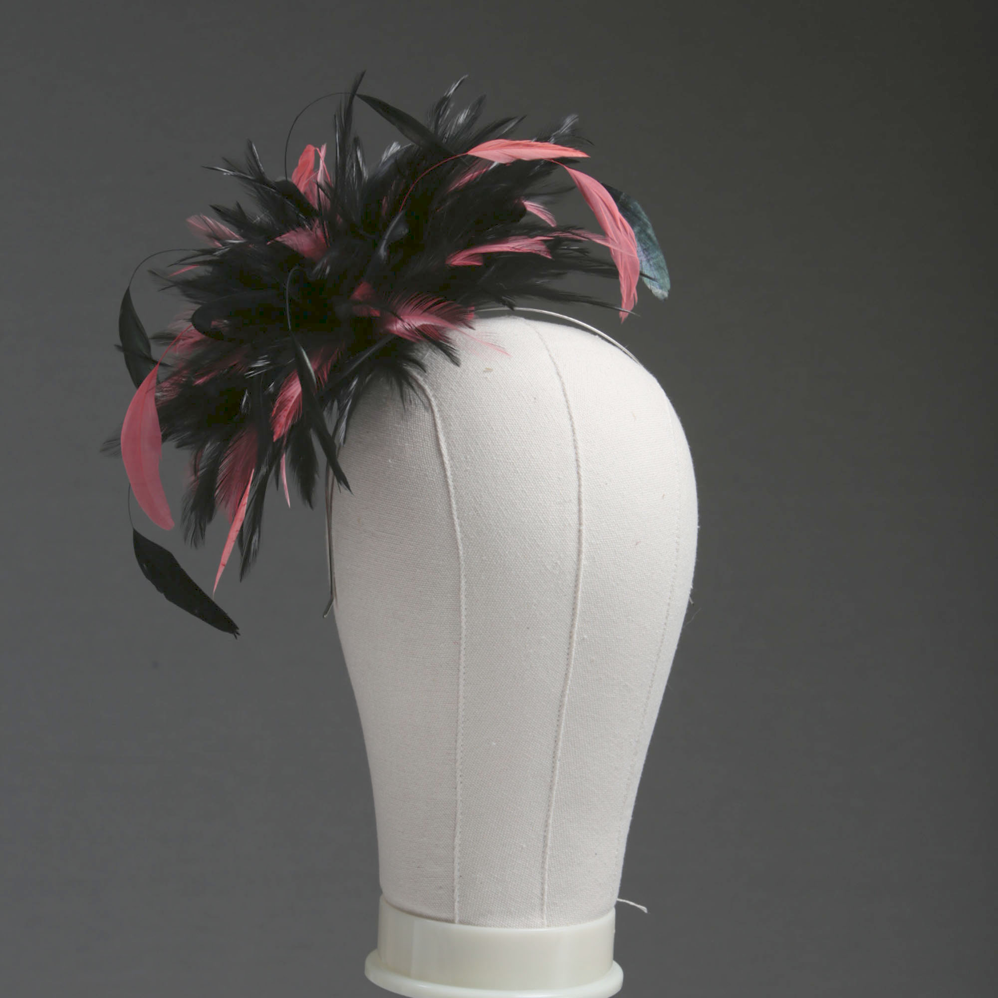Ladies wedding or races black and coral pink small feather and satin loop fascinator hat
