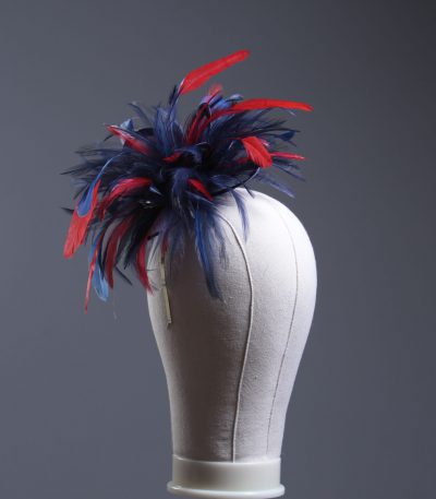 navy blue and red small hackle fascinator hat with feathers set on a headband