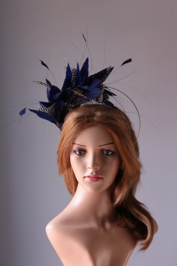 royal blue and black feather mount on a silver halo crown