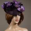 Aubergine sinamay saucer fascinator hatinator hat with purple and black orchid flowers