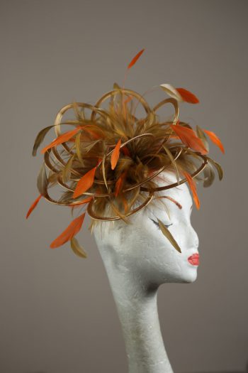 Gold satin Loop Fascinator Hat with gold and orange feathers