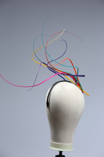 Rainbow multi-coloured quill floating fascinator hat set on a headband