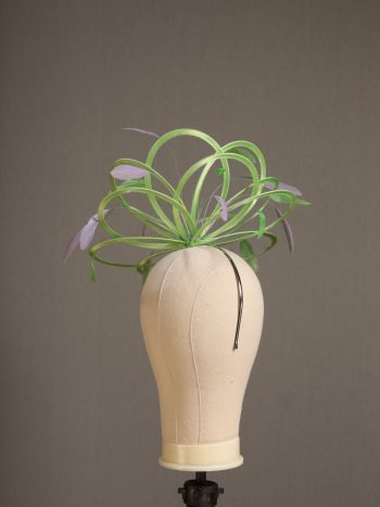 Ladies' formal Apple lime green and Lilac medium feather and satin loop fascinator hat. Suitable for a wedding or ladies' day at the races