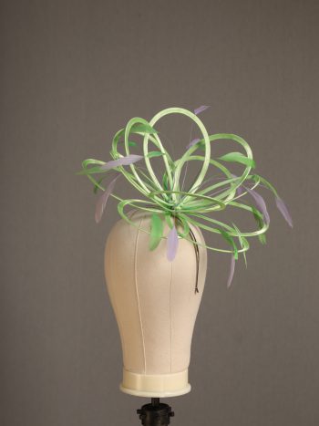 Ladies' formal Apple lime green and Lilac medium feather and satin loop fascinator hat. Suitable for a wedding or ladies' day at the races