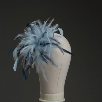 Ladies wedding or races baby blue and navy blue small feather and satin loop fascinator hat