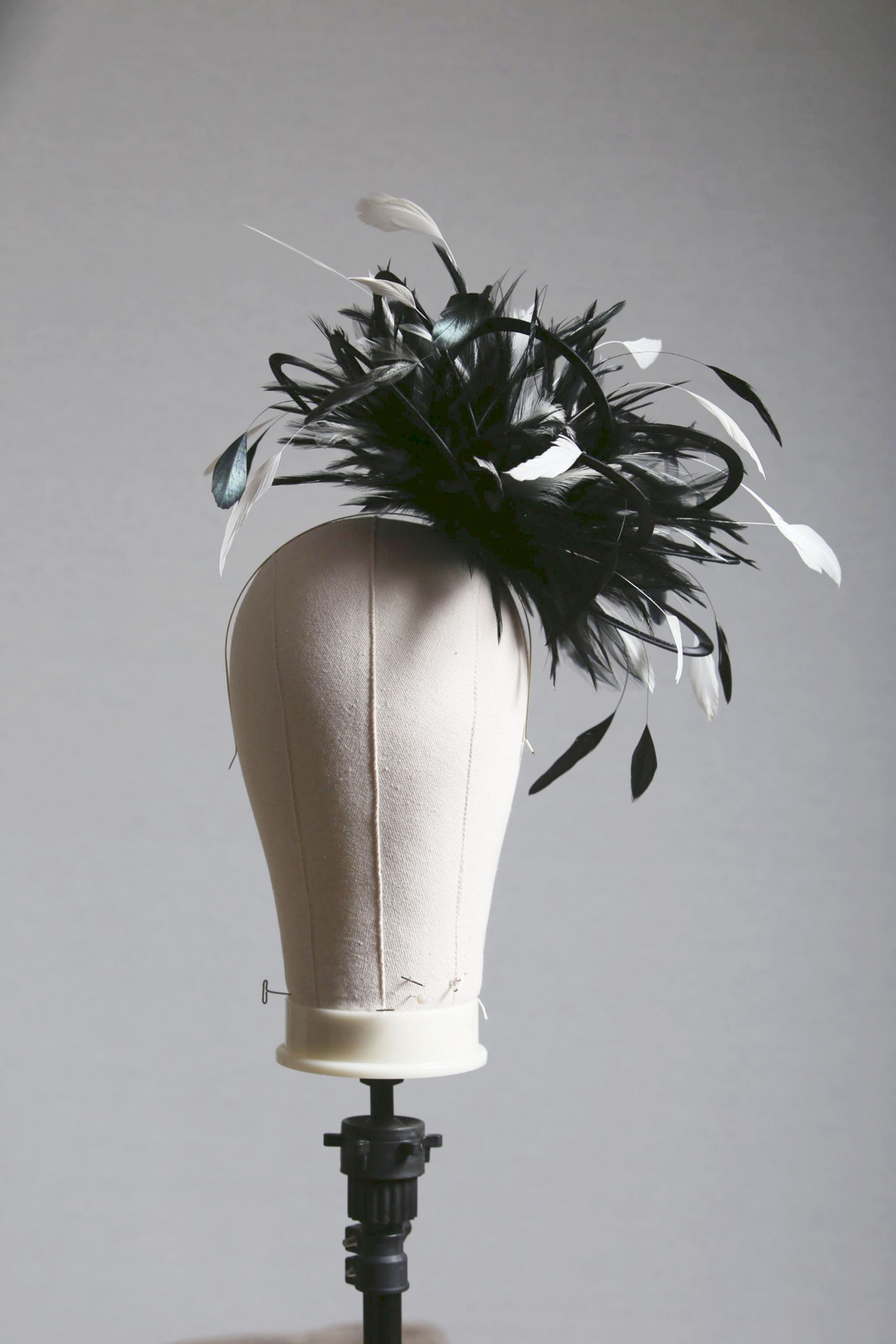Ladies formal black and white medium feather and satin loop fascinator hat. Suitable for a wedding or ladies day at the races
