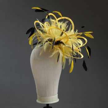 Ladies formal yellow and black medium feather and satin loop fascinator hat. Suitable for a wedding or ladies day at the races