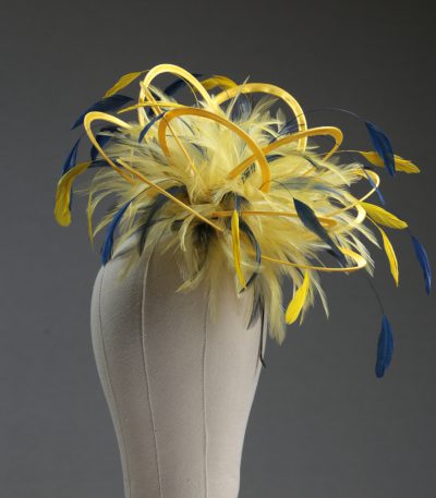 Ladies formal yellow and navy blue medium feather and satin loop fascinator hat. Suitable for a wedding or ladies day at the races