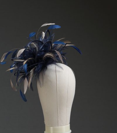 Ladies' formal Navy Blue and Taupe Nude medium feather and satin loop fascinator hat. Suitable for a wedding or ladies' day at the races
