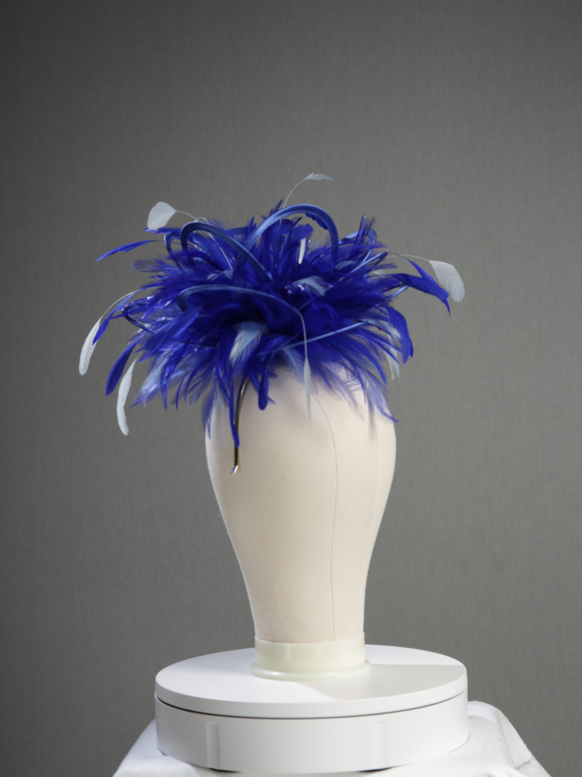 Ladies' formal royal blue and baby blue medium feather and satin loop fascinator hat. Suitable for a wedding or ladies' day at the races